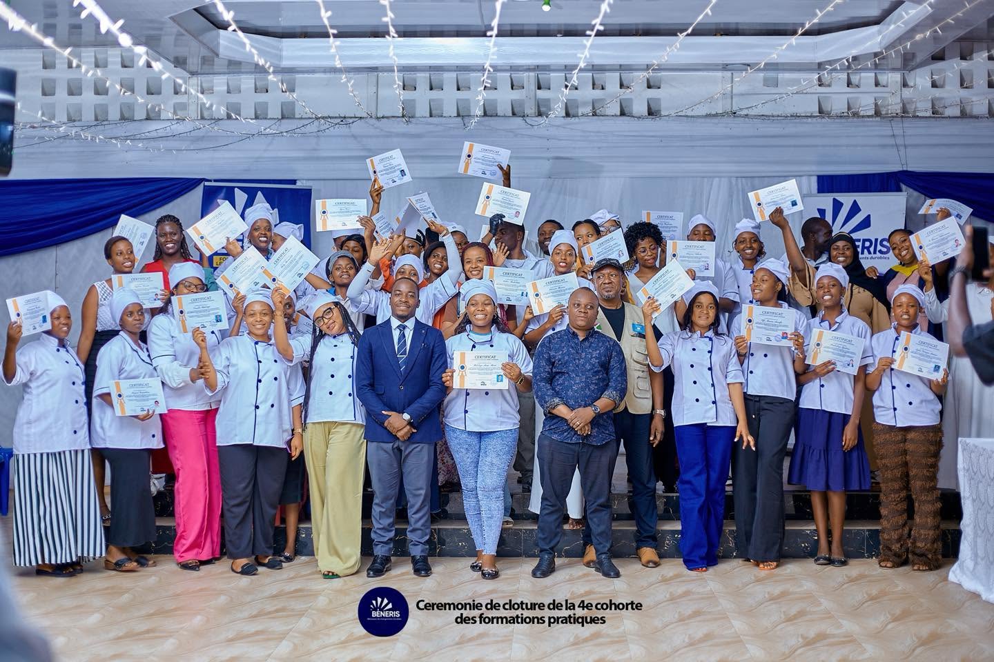 Improved cooking graduates celebrating with certificates