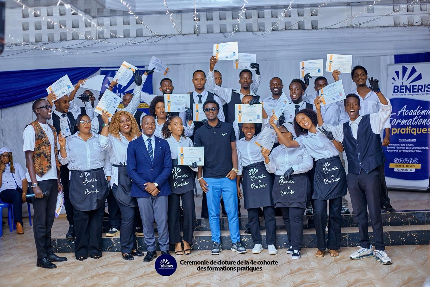 Barista & Bartender graduates raising their certificates